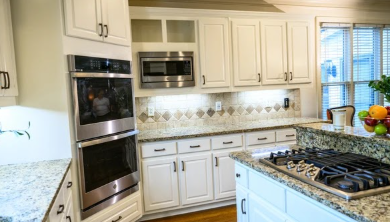 Double wall ovens and microwave in refinished cabinetry